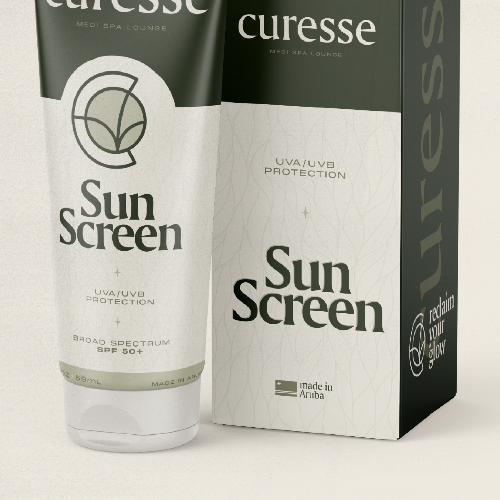 A bottle of sunscreen, blocking its packaging box, saying Made In Aruba with Aloe - UVA/UVB protection.